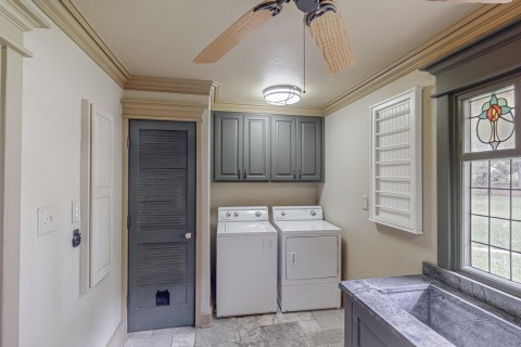 Laundry room Antique stained glass window, room for full size washer and dryer