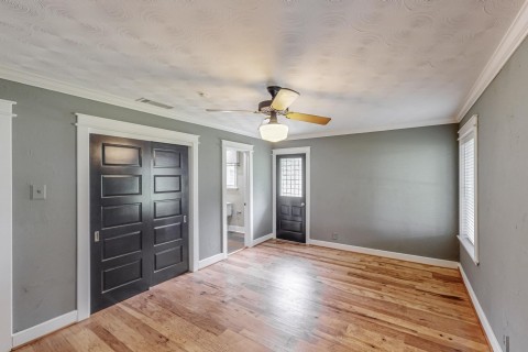 Bedroom 3 Outside door to access backyard, Huner ceiling fan and light, big closet with access to craw space