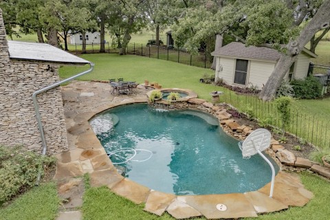 Salt water pool with hot tub, tanning ledge, water feature and PDA remote