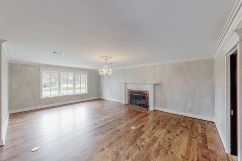 Living room view 2 with in floor electric, full masonry gas starter Fireplace