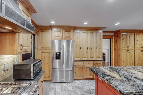 Kitchen featuring gas range, built in drawers and cabinet organizers, ceiling can lighting