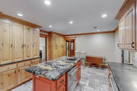 Kitchen featuring soapstone countertops to left