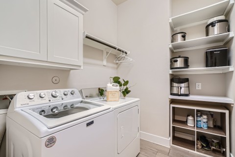 Oversized laundry room with storage shelves