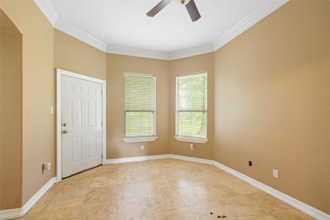 Another secondary bedroom complete with crown molding, tile floors and great closet space.