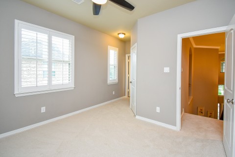 Large bedroom upstairs connects to bathroom