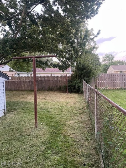 View of fenced backyard