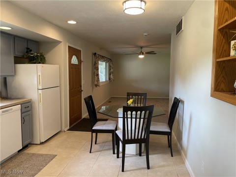 Dining space featuring a ceiling fan, recessed lighting, and light tile patterned flooring