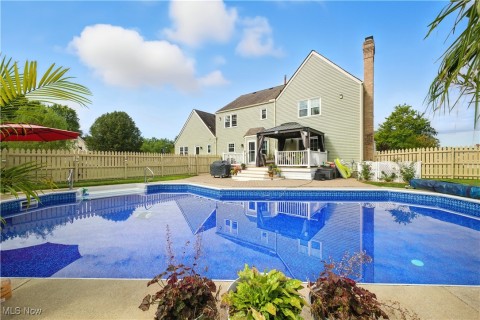 View of swimming pool with a gazebo, a patio, and a fenced backyard