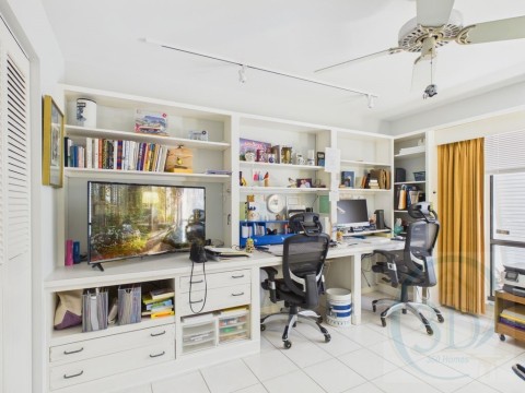 Used as Office featuring light tile patterned flooring, ceiling fan, track lighting, and built in desk