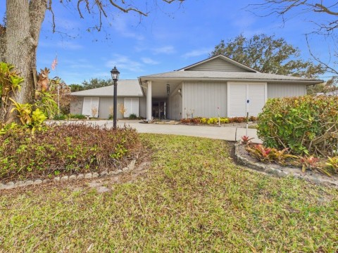 View of front of property with a front lawn
