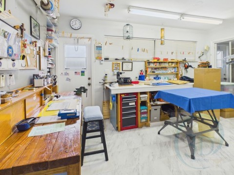 Misc room with a workshop area