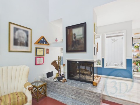 Sitting room featuring a multi sided fireplace