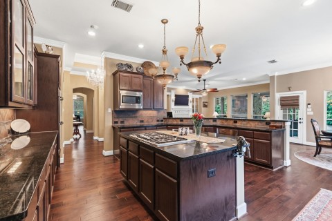 Another view of this amazing kitchen. Plenty of counter space for your meal prep. The utility sink will aid in your meal prep! There is room for several cooks in this kitchen.