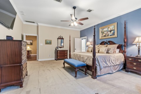 Experience the elegance of this stunning primary bedroom.