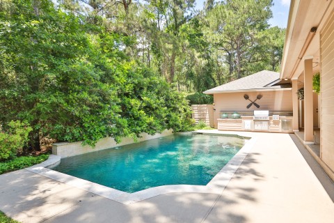 Savor outdoor dining with a fully-equipped kitchen, perfect for family gatherings or intimate meals.