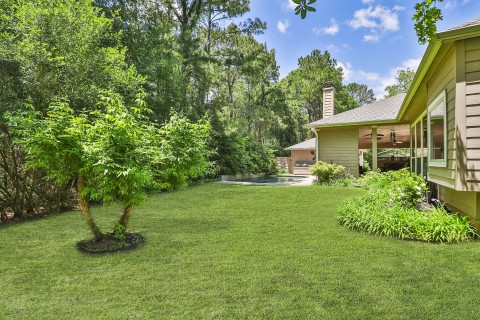 Relax on the bench and soak in the tranquility of this serene backyard oasis and all it has to offer.