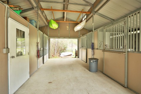 Three stalls complete with stall mats, auto waters in each stall, tack room/storage area.