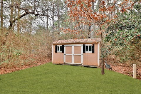 Storage shed to store all your lawn and landscaping essentials.