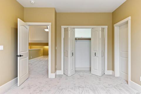 Second upstairs bedroom, with access to additional storage.