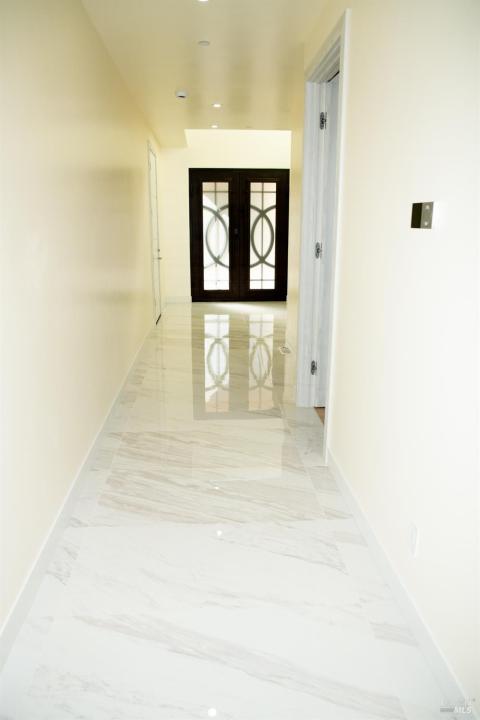 Looking down the long hallway towards the front door.