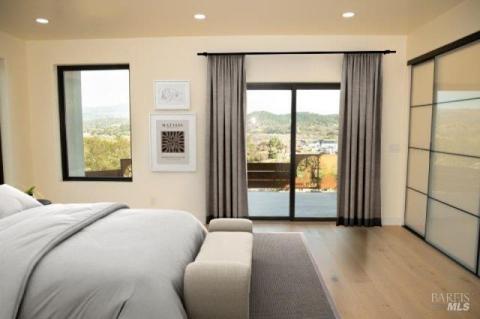 Downstairs bedroom en suite with direct access to the pool and patio. Virtually staged.