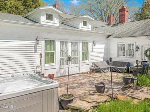 Back of home; patio with hottub