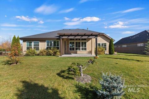Rear view of property with a patio and stucco siding