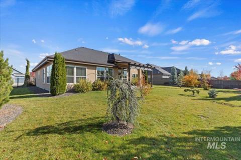 Back of house featuring stucco siding
