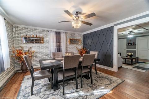 Enjoy your Beautiful Dining area complete with custom carpentry work and brick wall accent details