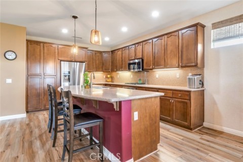 Open Kitchen Has Large Granite Center Island + Plenty Storage Cabinets
