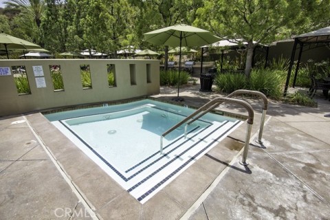 Relaxing Hot Tub Is By Outdoor Pool