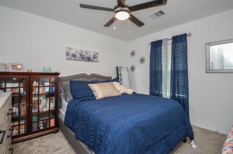 Secondary upstairs bedroom with walk in closet.