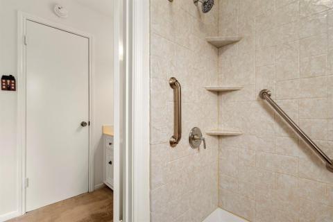 Jacuzzi walk in shower that is handicap accessible.