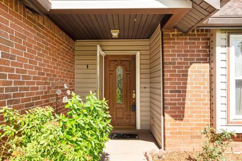 Lead glass insert in the front door for additional natural light in the home.  For more natural light, this home also has storm doors.
