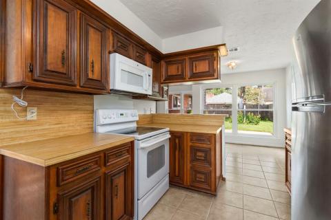 The Kitchen looks out into the Breakfast Room.