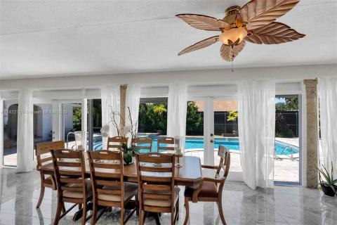 Facing the pool and outdoor bar area