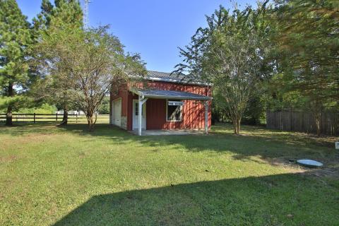 Spacious barn ideal for storage, a workshop, or versatile family needs. Spacious barn ideal for storage, a workshop, or versatile family needs.