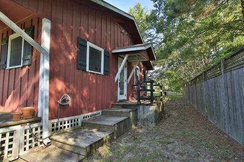 The side porch and door to get into the house. The side porch and door to get into the house.