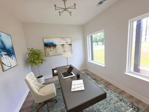 Home office with wood finished floors and a chand