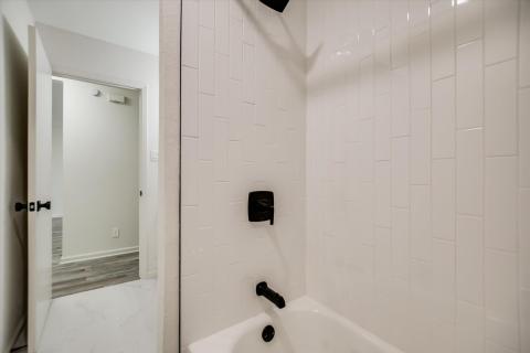 Full bath with  shower combination and marble loo