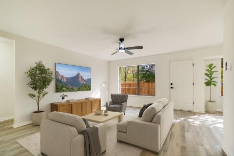 Living area with light wood-type flooring and a c
