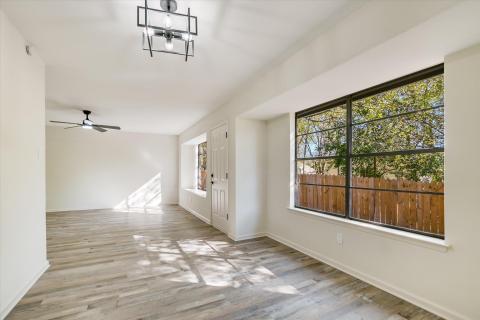 Entryway with light wood-style flooring and a cei