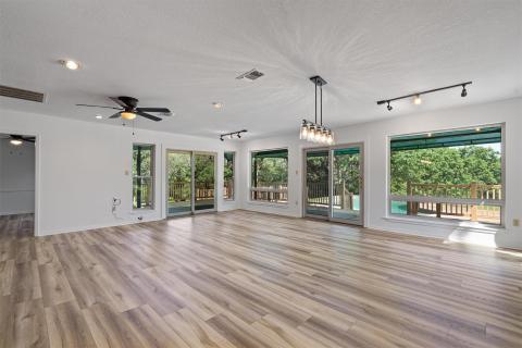 Unfurnished living room featuring a textured ceil