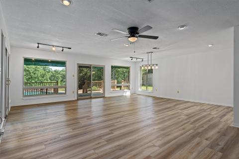 Spare room with a textured ceiling, ceiling fan, 