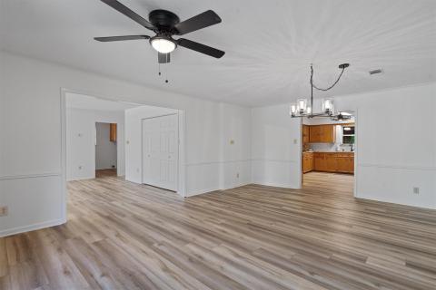 Unfurnished living room with a chandelier, ceilin