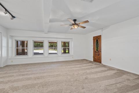 Unfurnished room with carpet flooring, baseboards