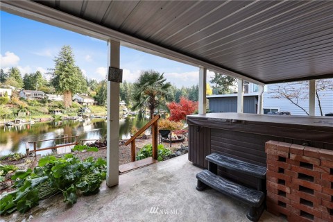 Exit off basement. Part of patio is designed to keep you dry as you enjoy the Hot Tub, and yes, it is included! Imagine soaking here after a long hard day or warming up after swimming late in the summer months. Exit off basement. Part of patio is designed to keep you dry as you enjoy the Hot Tub, and yes, it is included! Imagine soaking here after a long hard day or warming up after swimming late in the summer months.