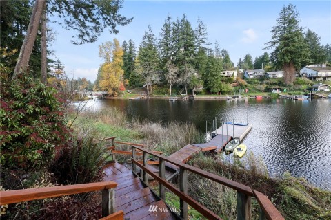 View of the stairway leading to the new dock. Kayaks, paddle board included with a compelling offer. View of the stairway leading to the new dock. Kayaks, paddle board included with a compelling offer.
