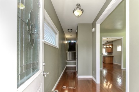 Nice hardwood floors throughout.  Wooden blind window treatments too.