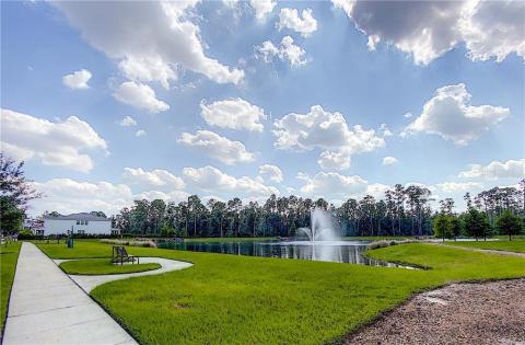 Community offers ponds with water fountains and walking paths next to conservation